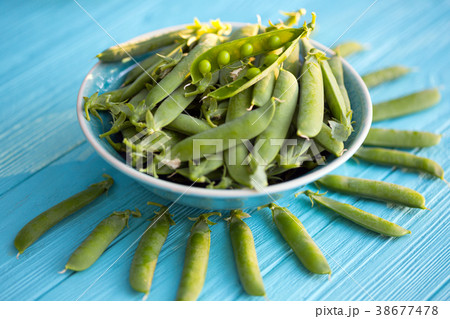 Green peas on a table Green peas on a table 38677478