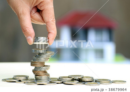 Woman hand put stack coins, Save money for home Woman hand put stack coins, Save money for home 38679964
