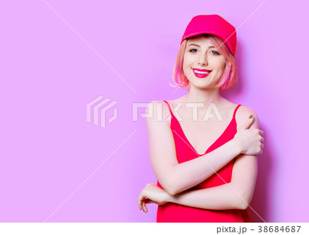 surprised young woman in cap 38684687