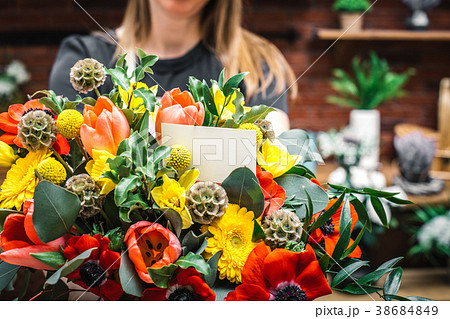 Florist presenting amazing lush bouquet 38684849