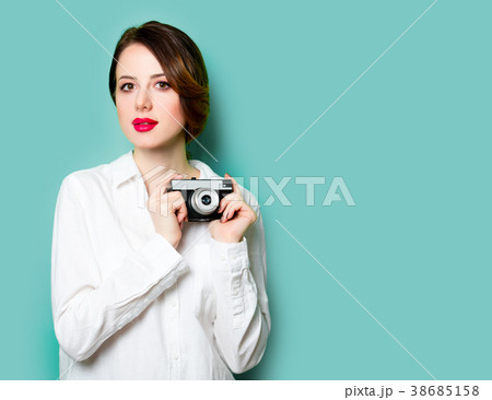 young woman with camera young woman with camera 38685158