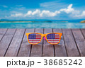 Sunglasses with american flag on wooden table 38685242