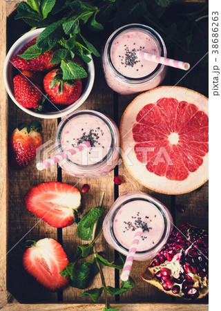 Pink fresh smoothies with grapefruit, strawberry 38686263