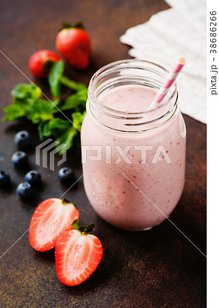 Pink berry smoothie in jar on dark background 38686266