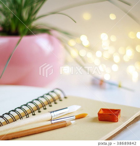 Blank notepad with watercolor and brushes 38689842