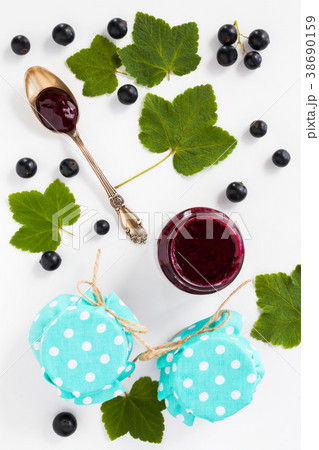 Homemade black currant jelly in the glass jars 38690159