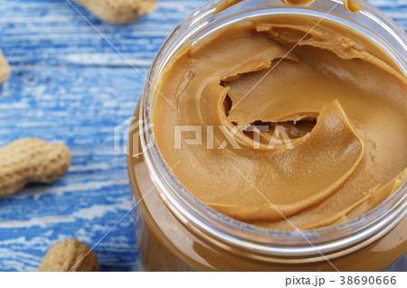 peanut paste on a wooden background 38690666