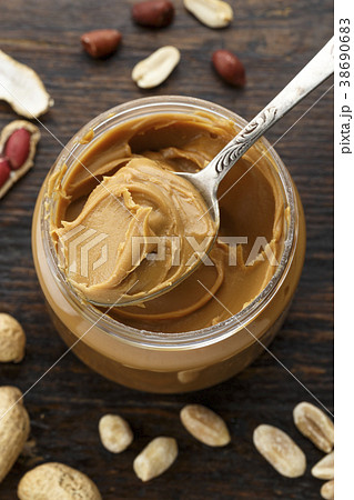 peanut butter in an open jar 38690683