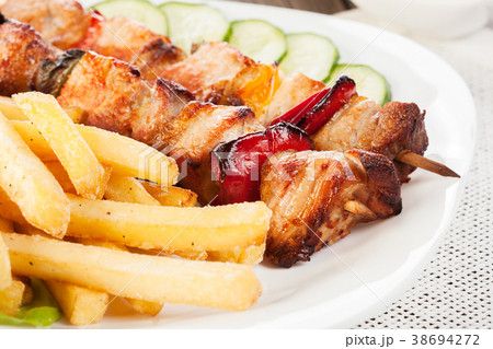 Grilled shashlik with french fries Grilled shashlik with french fries 38694272