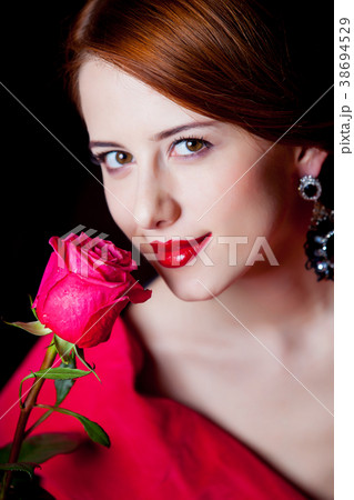 woman in red Victorian epoch clothes with red rose woman in red Victorian epoch clothes with red rose 38694529