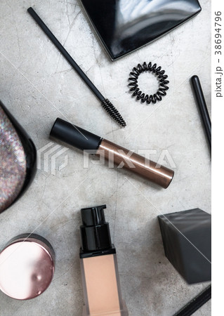 Luxury beauty products flatlay on grey table 38694796
