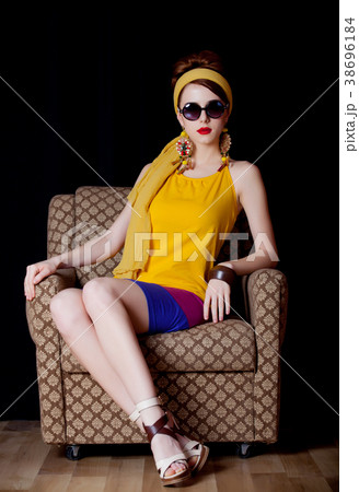 Young redhead girl in 70s clothes style 38696184