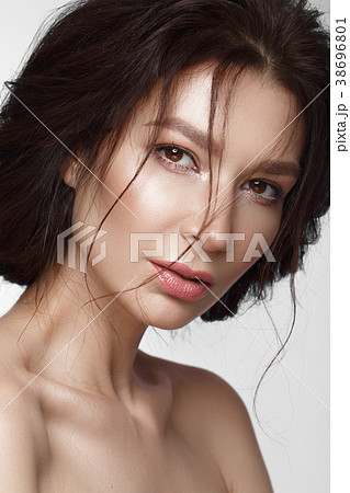 Beautiful woman with a light natural make-up and 38696801