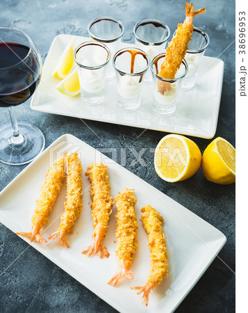King Prawn served with sauce and lemon. Sea food King Prawn served with sauce and lemon. Sea food 38696953