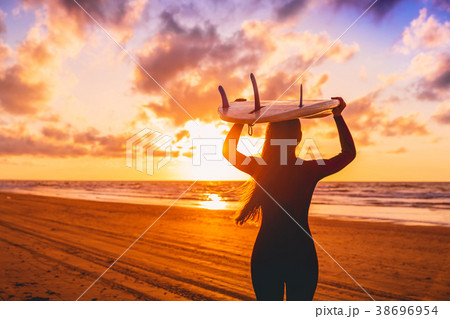 Surf girl with long hair go to surfing. Surf girl with long hair go to surfing. 38696954