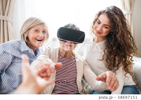 A teenage girl, mother and grandmother with VR 38697151