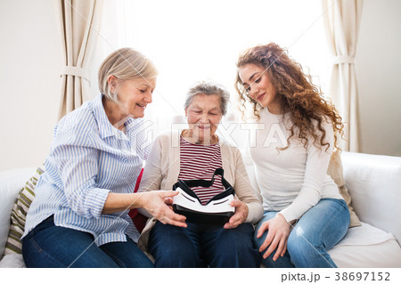 A teenage girl, mother and grandmother with VR A teenage girl, mother and grandmother with VR 38697152