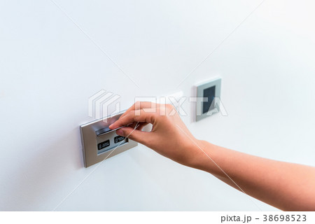 Close up of female hand inserting key card  38698523