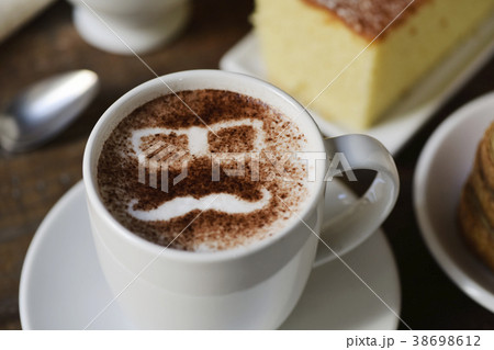 man face in a cup of cappuccino 38698612