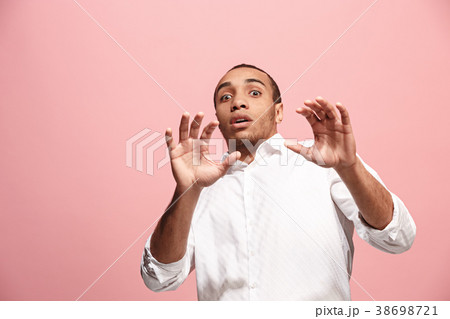 Portrait of the scared man on pink Portrait of the scared man on pink 38698721