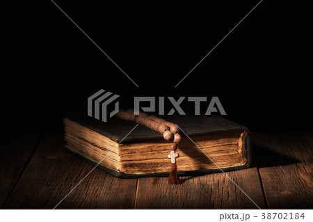 Old bible book on a wooden background 38702184