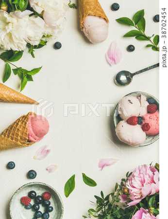 Flat-lay of ice cream scoops and peonies, vertical 38702454