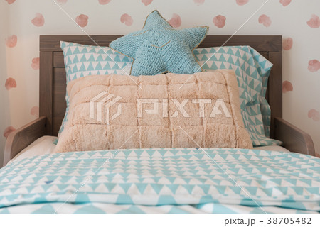 kid's bedroom with cozy bed and set of pillows kid's bedroom with cozy bed and set of pillows 38705482