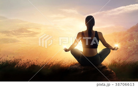 Woman meditating yoga in sunset mountains outdoor Woman meditating yoga in sunset mountains outdoor 38706613