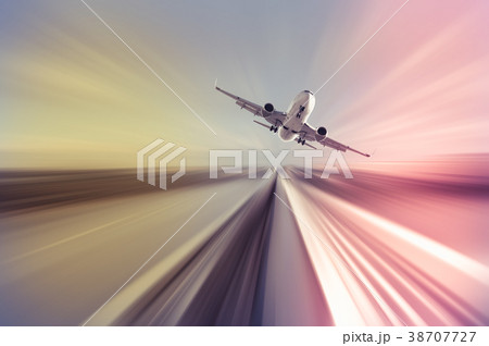 Airplane in motion over roadway Airplane in motion over roadway 38707727