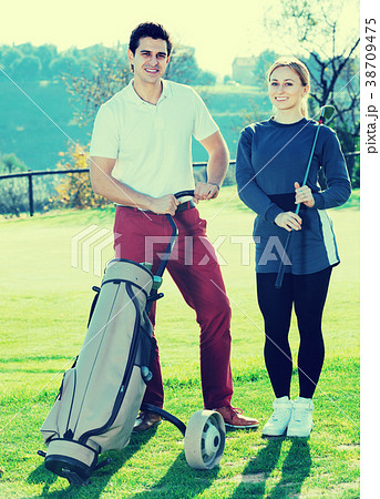 Golf players at golf course Golf players at golf course 38709475