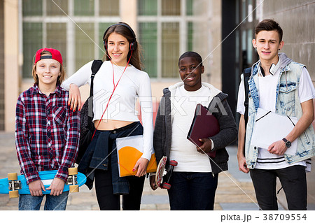 Group of teens posing outside school 38709554