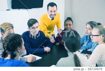 Students listening to teacher Students listening to teacher 38710070