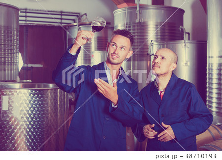 two workers on wine factory two workers on wine factory 38710193