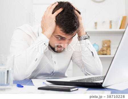 Man having problem in office Man having problem in office 38710228