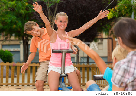 Children are teetering on the swing 38710380