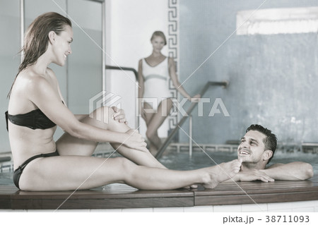 Portrait of girl in pool in time resting with her friends in spa. 38711093