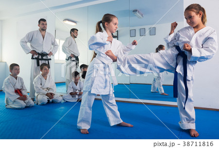 Girls training during karate class 38711816