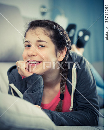 Girl posing playfully Girl posing playfully 38712296