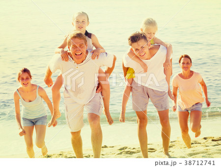 cheerful family on sandy beach . 38712741
