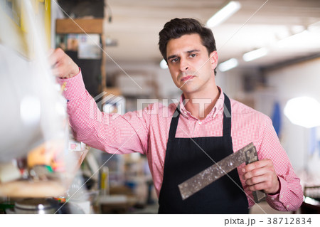 Carpenter standing in workshop Carpenter standing in workshop 38712834