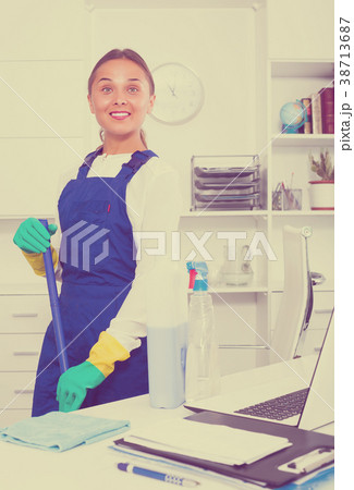 Woman cleaning at company office 38713687
