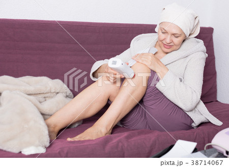 Woman doing body hair removal Woman doing body hair removal 38714067