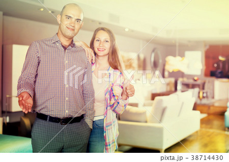 Couple is giving thumbs up as sign of successful purchase 38714430