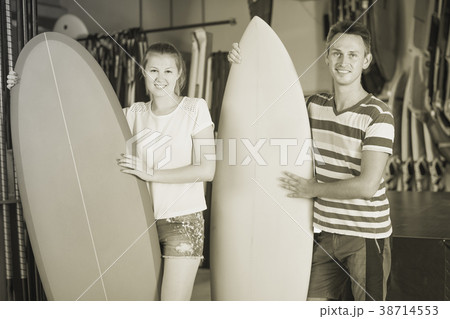 Glad couple is showing colorful boards Glad couple is showing colorful boards 38714553