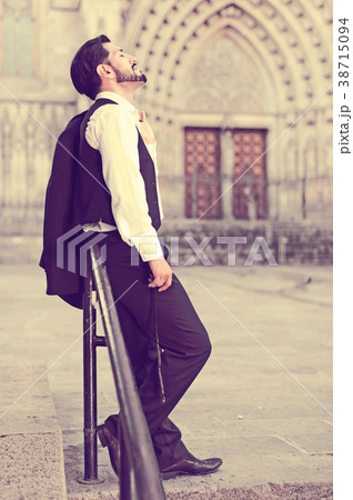 Full-length portrait of man near iron railings 38715094