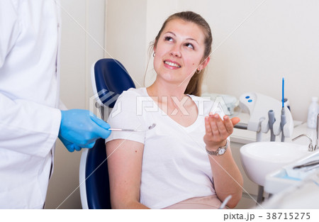 Female is talking with stomatologist Female is talking with stomatologist 38715275