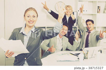 Happy business group with woman at office 38715327