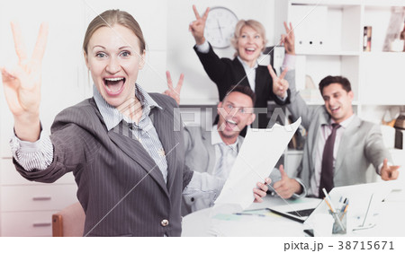 Happy business group with woman at office 38715671