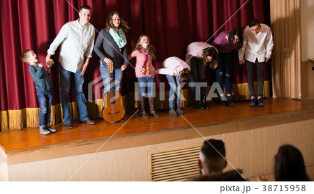 Performing group bowing to audience Performing group bowing to audience 38715958