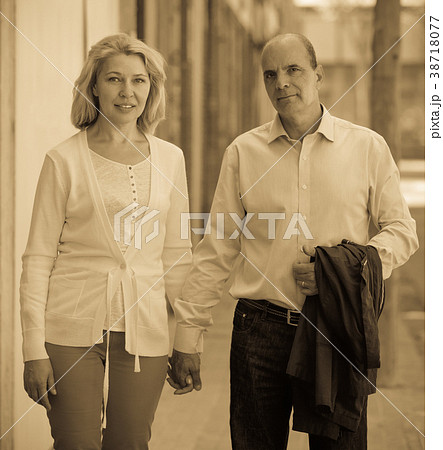 Walking through street mature family couple 38718077